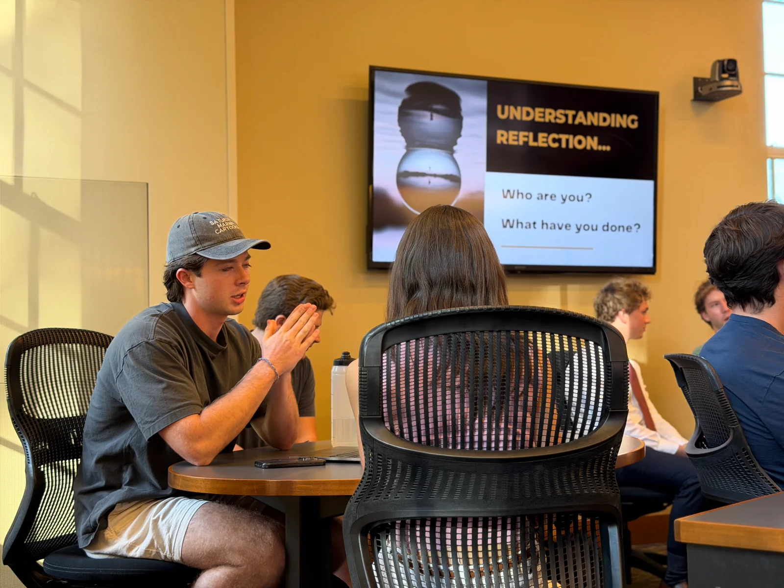 A DCC member explaining a point during a small-group discussion